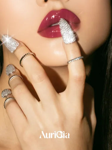 A close crop of red lips, a pavé Glint ring raised to them and more on the fingers below.