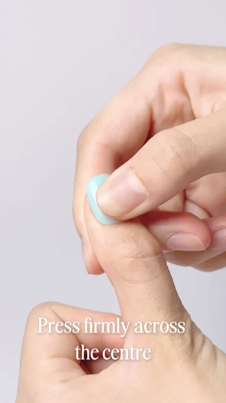 Step 9 of 10. Press firmly across the centre — a thumb pressing the middle of the seated press-on.